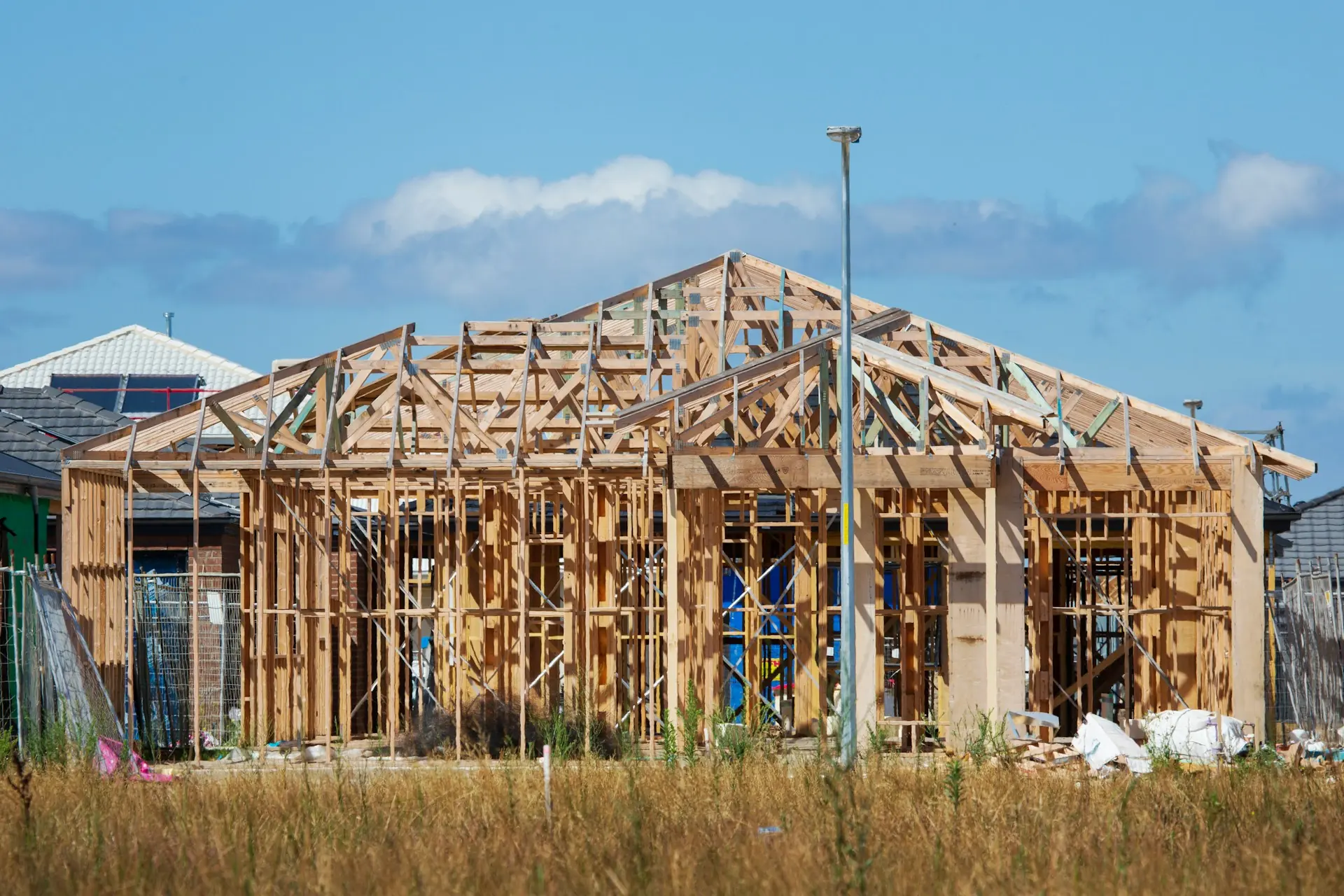 House framing with a full set of roof trusses in place