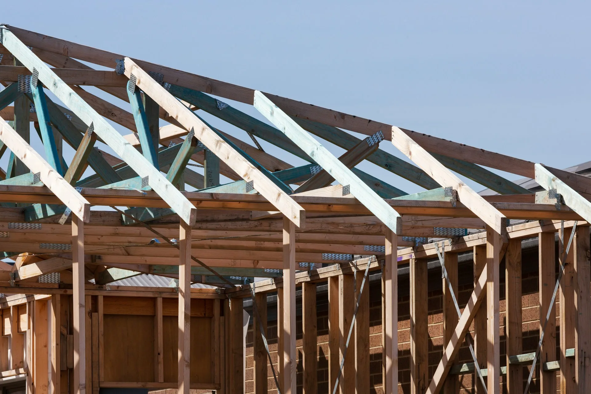 Row of roof trusses set on a house under construction